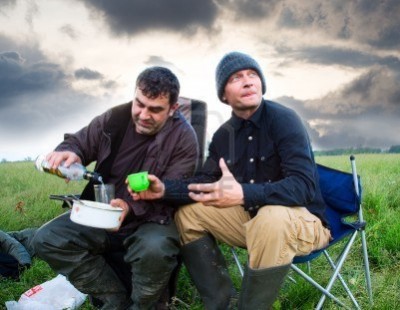 6946668-two-men-drink-vodka-on-the-nature.jpg